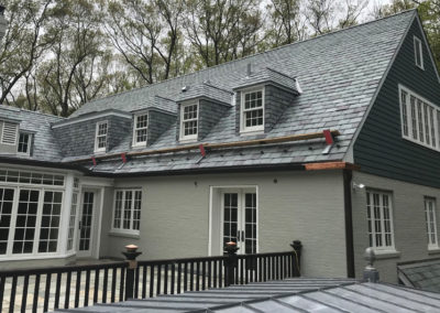 Graduated, random width slate roof and slate cladding for New Jersey residence