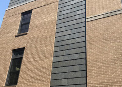 Slate cladding for luxury condominium complex: Greenstone Slate® Vermont Clear Gray installed using the Nu-lok™ slate installation system